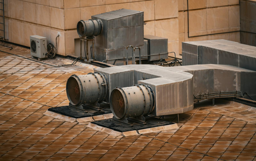 An industrial HVAC system installed on a modern building rooftop in Kuwait City.